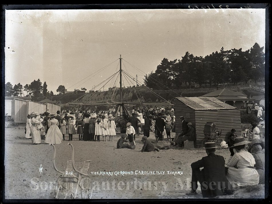 1910 Crowds pictured around the merry go round at Caroline Bay Timaru dated 27 December 1910 SCM 1999636