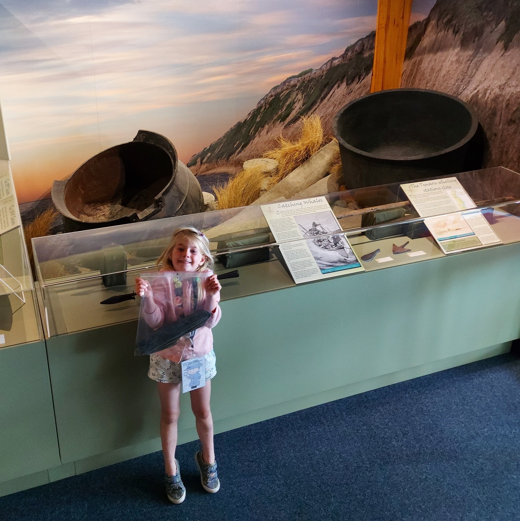 Whale Medinella Fauth with the whale bone she found at the musem whale display